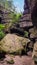 Massive fallen down sandstone rock on a forest path, Saxony, Germany