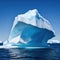 massive floating iceberg in the with visible tip above the water and a