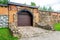 Massive gate in big stone wall