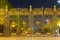 Massive gates, fence with spiky, in the evening. night