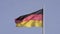 Massive German flag flies in slow motion in strong breeze