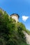 Massive high walls and a tower of an old medieval castle