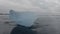 Massive iceberg over the black sand in slow-mo