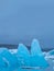 Massive Iceberg peaks on Jokulsarlon lagoon under clear sky