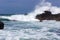 Massive implacable waves of the Pacific Ocean crash upon the unbreaking volcanic rock of Costa Rica`s Playa San Janillo.