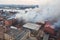 Massive large blaze fire in the city, aerial drone top view brick factory building on fire, hell major fire explosion flame blast