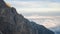 Massive mountain ridge towering above the clouds and catching the last light, Slovakia, Europe