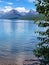 Massive mountains and blue calm lake background