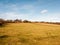 massive open plain farm field grass agriculture england blue sky ahead