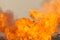 Massive orange fire explosion in military combat and war. Vehicle explosure from a tank in a city in the Middle East. Military