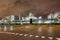 Massive petrochemical production plant against a cloudy sky at night, Port of Antwerp, Belgium.