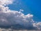 Massive rain clouds - Cumulus congestus - creates a wall of clouds in the blue sky