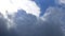 Massive rain clouds - cumulus congestus or towering cumulus - forming in the blue sky