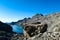 A massive rock with scenic view on the mountains of Hohe Tauern Alps in Carinthia, Austria, Europe. Lake reflection and water