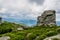 Massive rocks on a green mountain top