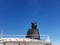 Massive smoke stack exhaust on a cruise ship with blue sky background on a sunny day