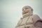 Massive statue of the Sitting Smiling Buddha at the Vinh Tranh P