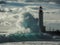 Massive wave crashes into the lighthouse