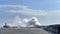 Massive waves crash over harbour wall onto lighthouse during huge storm on English coastline in Newhaven, amazing images showing