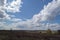 Massive white cumulus clouds in the blue sky