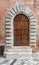 Massive wooden doors typical of southern Italy