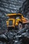 Massive yellow anthracite mining truck at open pit coal mine for industry operations