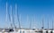 Mast against a blue sky, ship mast, marina in European city, the