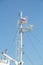 Mast of a large white motor ship in the sea with the flag of Russia
