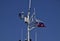 Mast of the port service ship. Devices of light signaling and communication antenna.