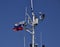 Mast of the port service ship. Devices of light signaling and communication antenna.