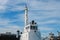 Mast of Tugboat on blue sky background.