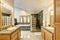 Master bathroom interior with tile flooring and modern cabinets.