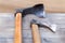 Master construction tool ax and bark scraper on wooden background