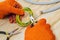 Master electrician with pliers cuts a wire on a working wooden table