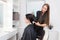 The master hairdresser blows the client`s hair with a hairdryer, keratin recovery. hair care concept