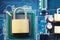 Master key or Gold Padlock on electronic motherboards background