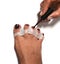 The master makes pedicures on toenails. Silicone finger device.