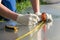 Master measures tape measure the size of polycarbonate for the greenhouse