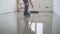 Master with a needle roller. Filling the floor. A contractor painter will paint the garage floor to speed up the sale of your home