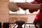 Master pouring freshly brewed tea into cup during traditional ceremony at table, closeup