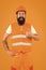 Master of quality. Master builder showing thumbs up on orange background. Bearded man master happy smiling in protective