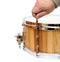 Master tuning new wooden snare drum isolated