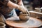 master is working on a potter\\\'s wheel, in an apron, in the style of muted, earthy tones