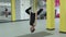 The master of yoga do an inverted pose hanging on a hammock tape for aerial yoga