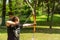 Masterful Archery Display: Young Archer Takes Aim in Forest at Medieval Knight Festival