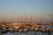 Masts of sailboats at sunset