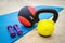 Mat for fitness with dumbbells, weight and ball