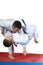 On the mat sportsmen are training judo throws