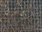 Matal industry grid fence pattern with natural brown weeds