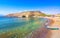 Matala beach with caves on the rocks, Crete, Greece.